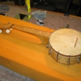 rare old small 4 string banjo
